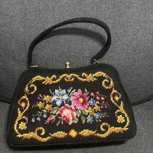 Woman’s needlepoint purse